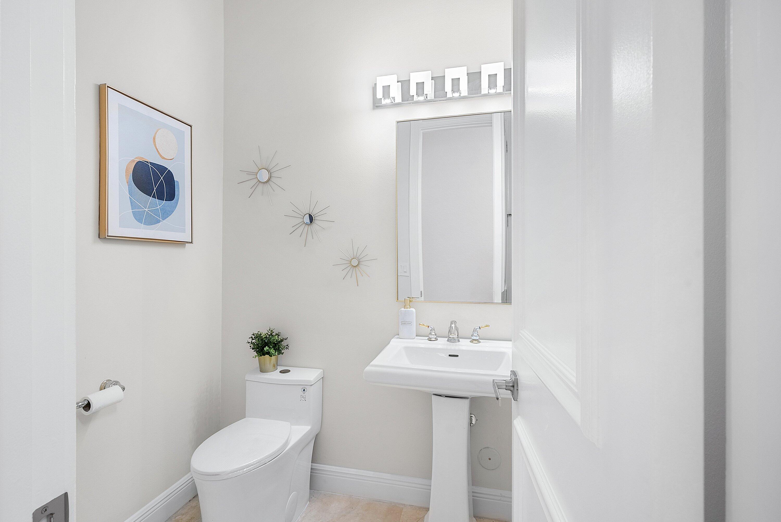 6468 Polo Pointe Way Delray Beach, FL 33484 - Photo 28 of 89 a view of bathroom with a sink and mirror