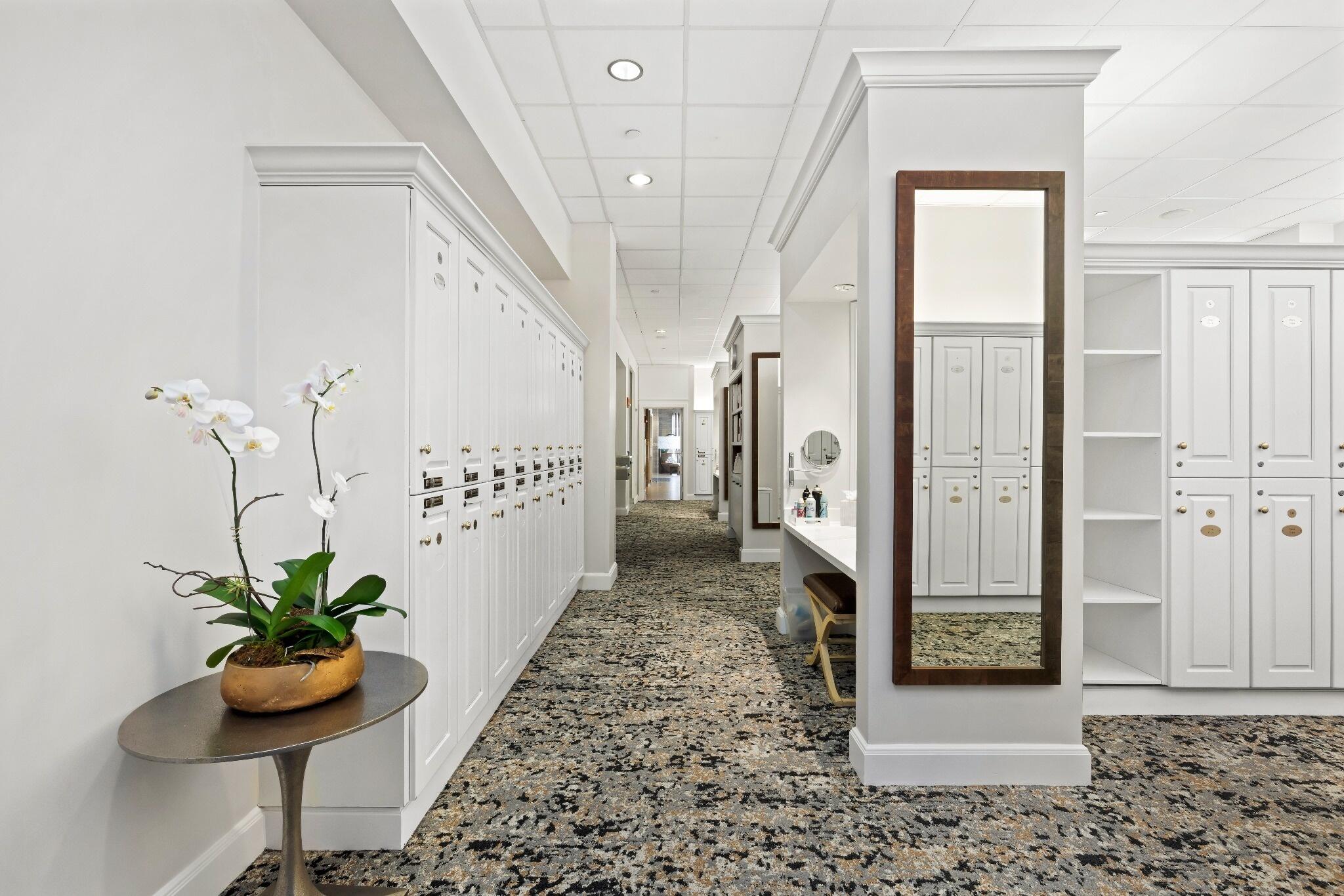 6468 Polo Pointe Way Delray Beach, FL 33484 - Photo 40 of 89 a view of a hallway with wooden floor and a potted plant