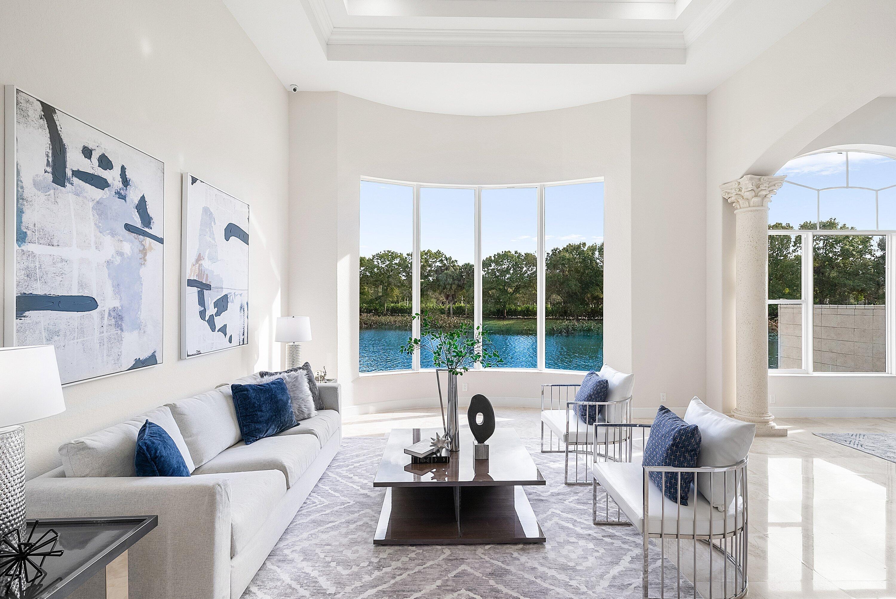 6468 Polo Pointe Way Delray Beach, FL 33484 - Photo 4 of 89 a living room with furniture and a large window
