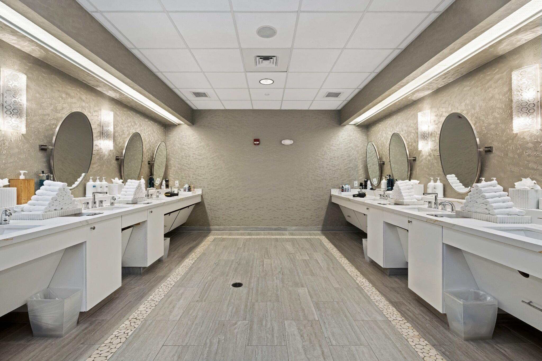 6468 Polo Pointe Way Delray Beach, FL 33484 - Photo 42 of 89 a bathroom with a double vanity sink and a mirror