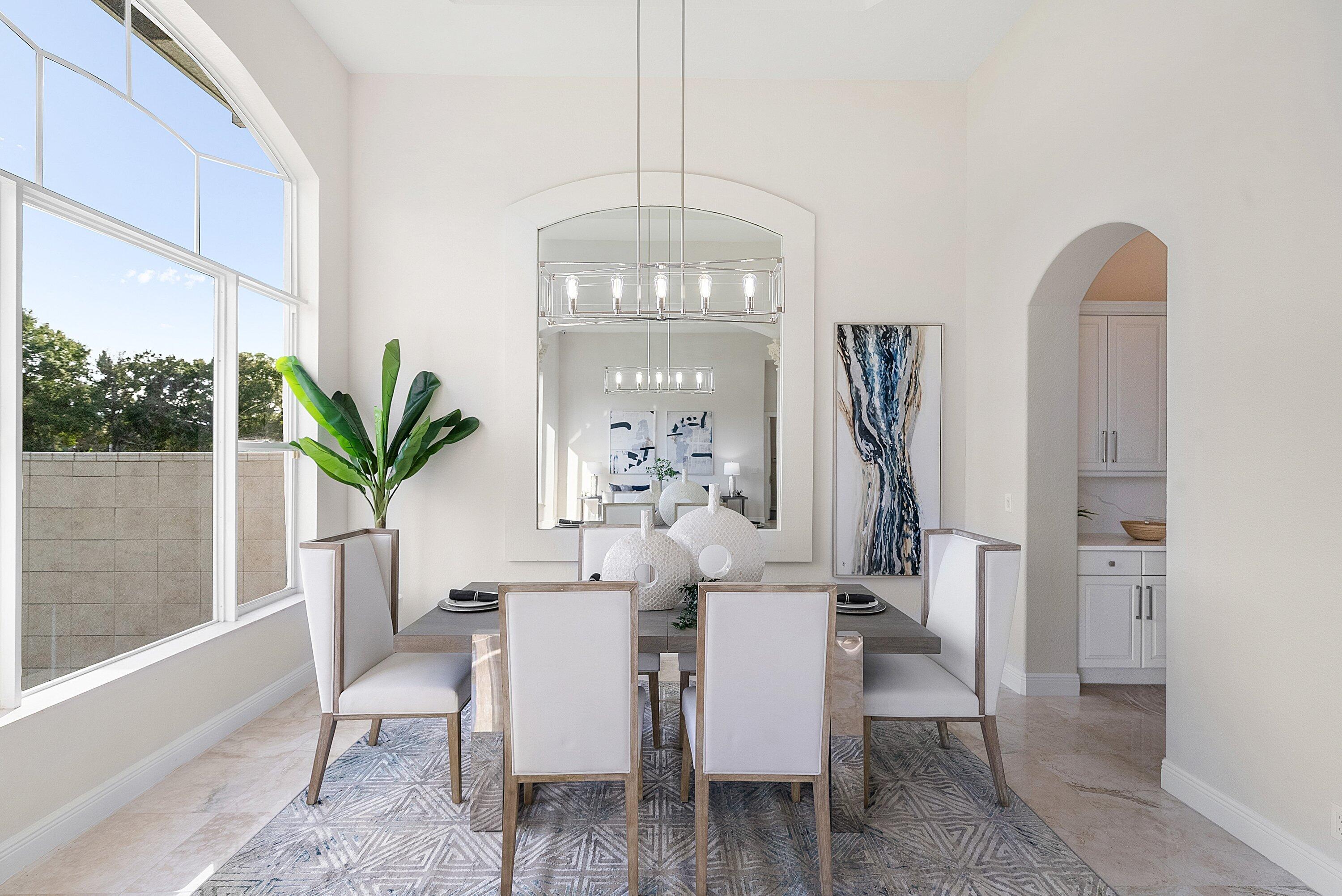 6468 Polo Pointe Way Delray Beach, FL 33484 - Photo 9 of 89 a view of a dining room with furniture window and wooden floor