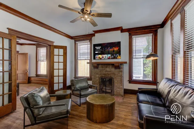 a living room with furniture and a flat screen tv
