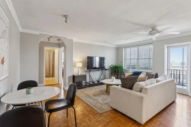 a living room with furniture and a window