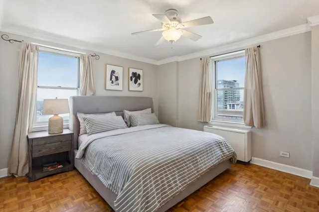 a bedroom with a large bed and a window