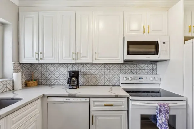 a kitchen with a stove and a microwave