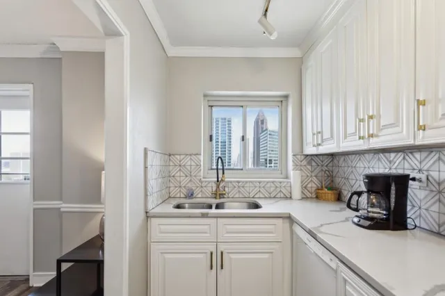 a kitchen with a sink and a fireplace