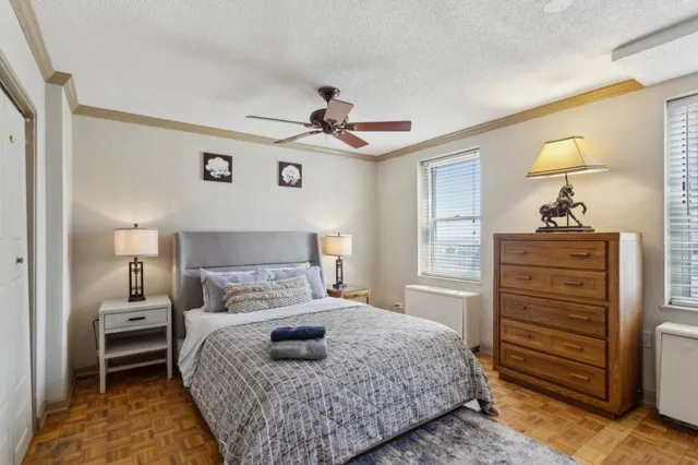 a bedroom with a bed and a dresser