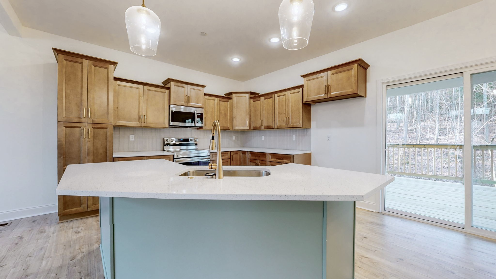 1208 Rooster Rdg Road Joelton, TN 37080 - Photo 3 of 25 a kitchen with a sink a stove a microwave and a refrigerator