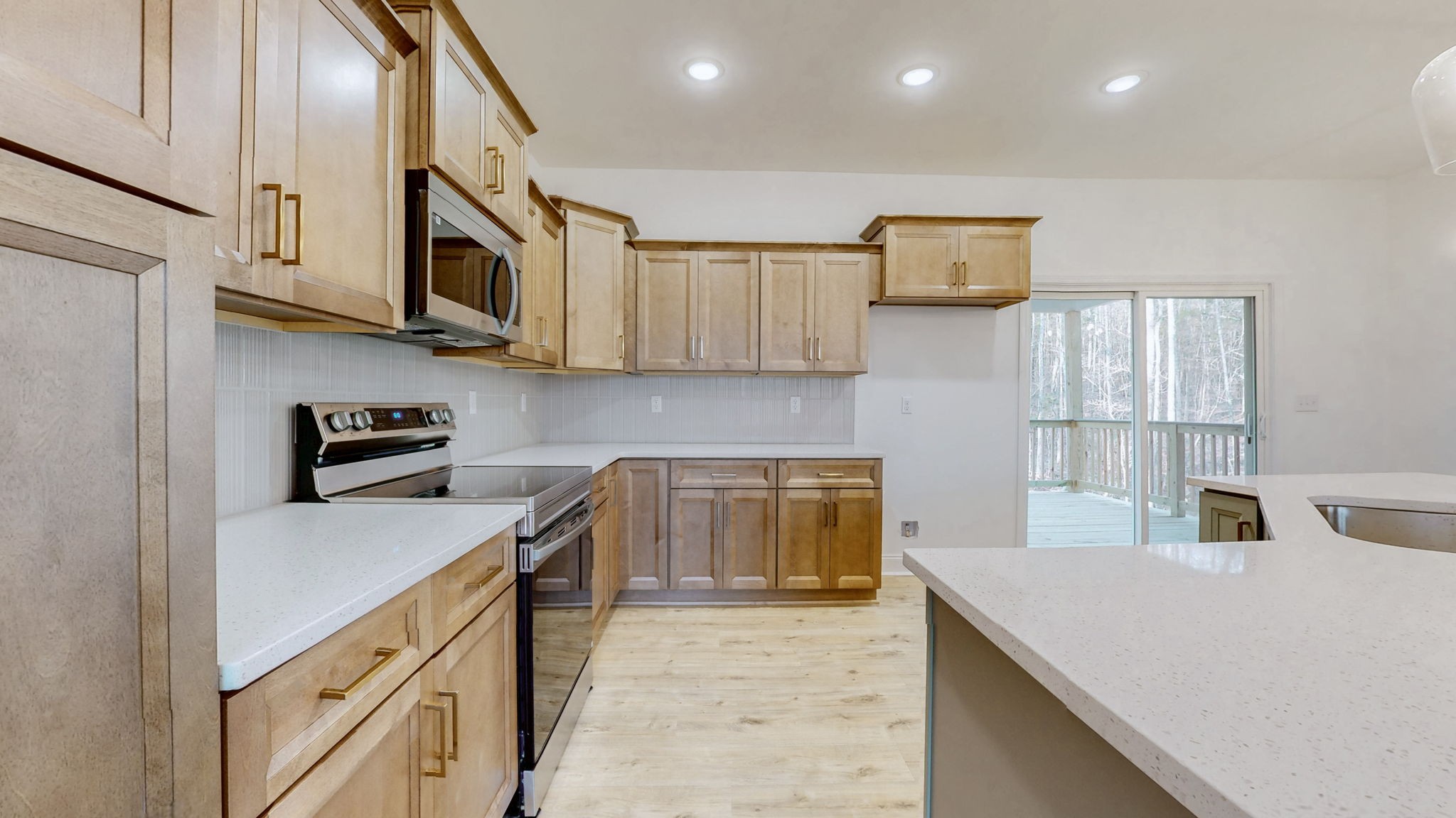 1208 Rooster Rdg Road Joelton, TN 37080 - Photo 4 of 25 a kitchen with stainless steel appliances granite countertop a sink stove and microwave