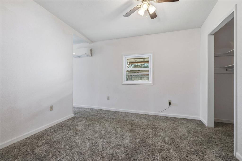1729 Elliot Drive Canton, TX 75103 - Photo 26 of 40 Split connecting bedroom with carpet flooring, ceiling fan, and a closet
