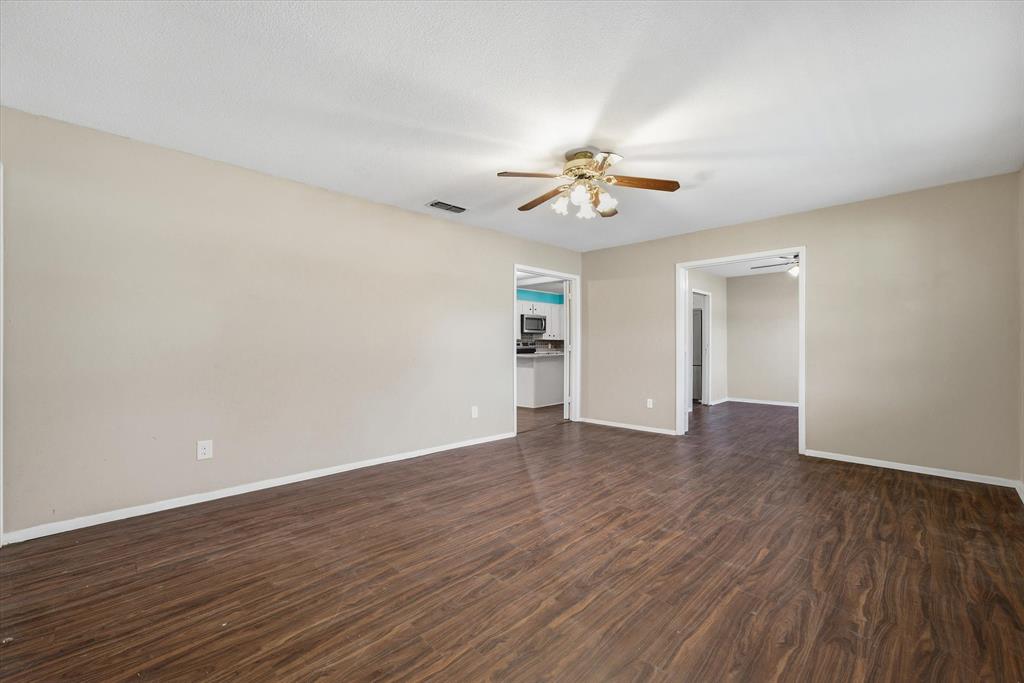 1729 Elliot Drive Canton, TX 75103 - Photo 6 of 40 Front Living room featuring dark wood-style flooring and ceiling fan