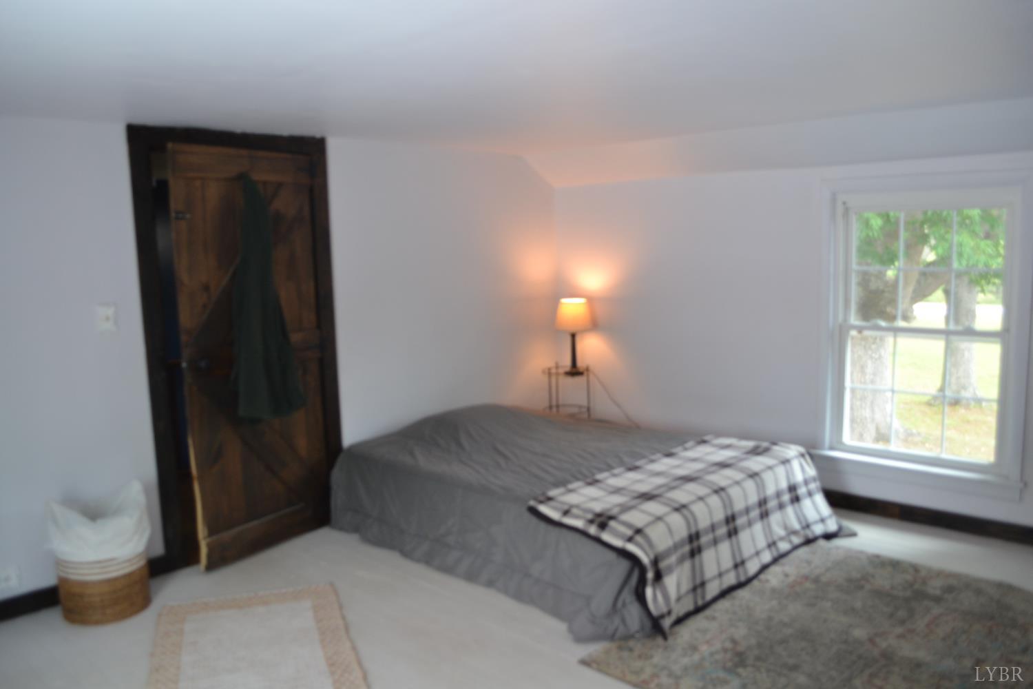 6387 Red House Road Rustburg, VA 24588 - Photo 29 of 38 a bedroom with a bed and a window