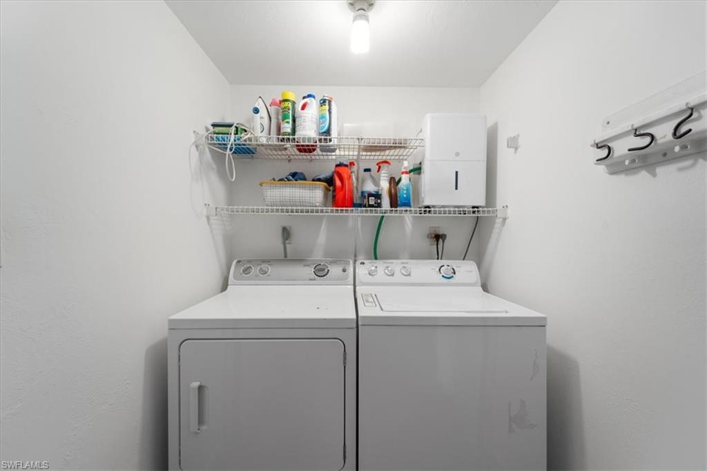 307 Goodlette-Frank Road, Unit B202 Naples, FL 34102 - Photo 13 of 21 a utility room with dryer and washer