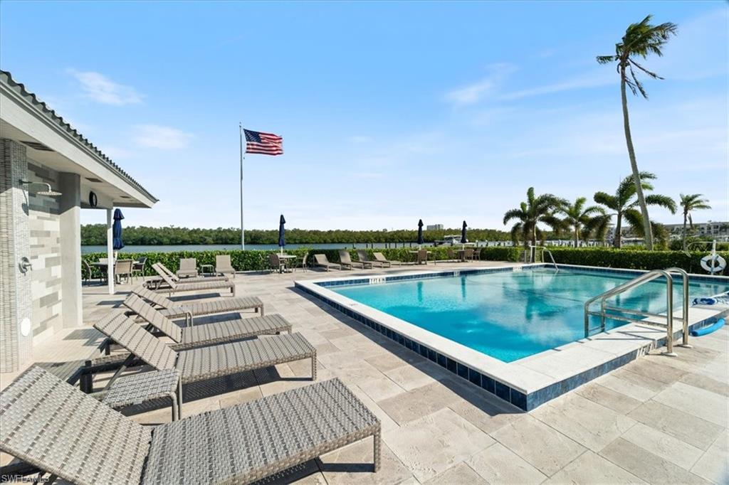 307 Goodlette-Frank Road, Unit B202 Naples, FL 34102 - Photo 19 of 21 a view of a terrace with couches and sky view