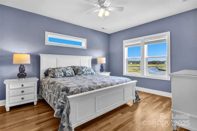 a bedroom with a bed and a flat screen tv in it