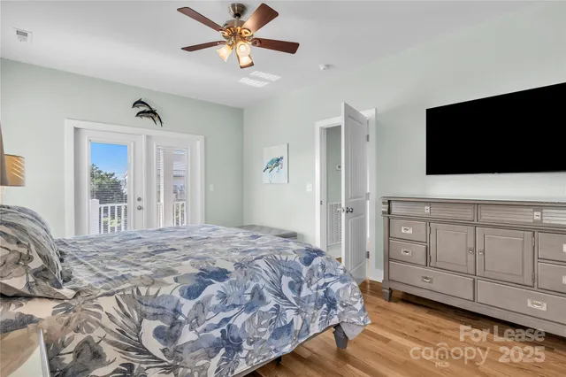 a bedroom with a large bed and a window