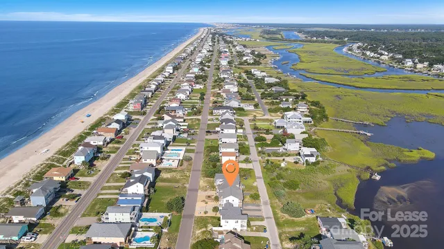 a kitchen with kitchen island a sink stove and refrigerator