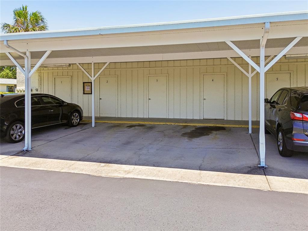 11340 Carriage Hill Drive, Unit 4 Port Richey, FL 34668 - Photo 22 of 36 a view of car garage