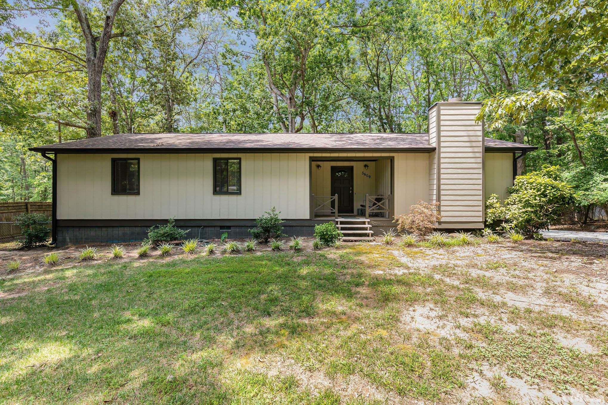 5609 Roslyn Road Durham, NC 27712 - Photo 1 of 31 a house with a yard