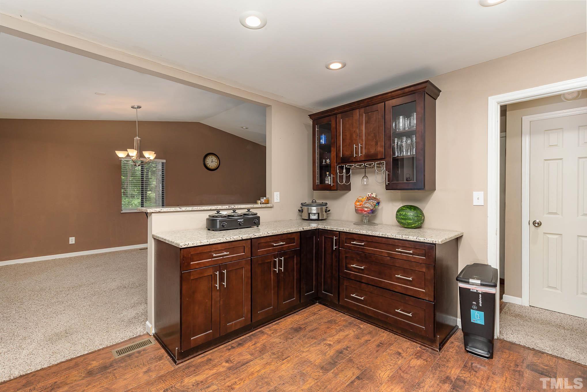 5609 Roslyn Road Durham, NC 27712 - Photo 11 of 31 a spacious bathroom with a sink and a mirror