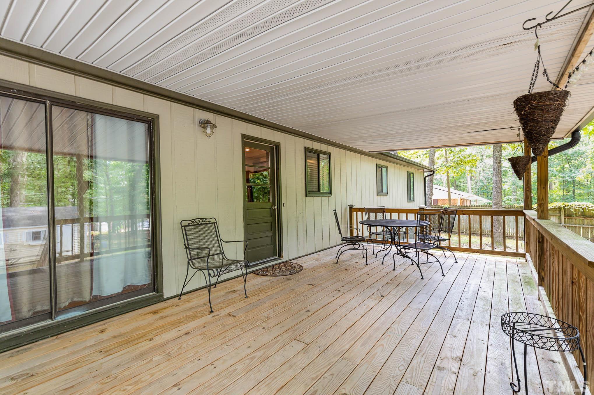 5609 Roslyn Road Durham, NC 27712 - Photo 25 of 31 a view of a balcony with wooden floor
