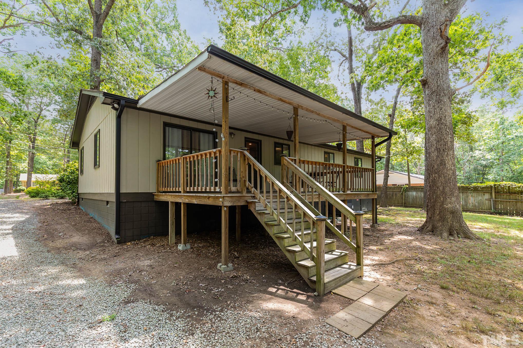 5609 Roslyn Road Durham, NC 27712 - Photo 29 of 31 a view of house with a yard and balcony