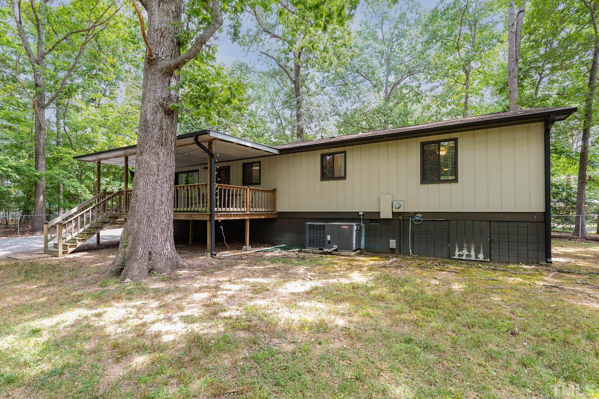5609 Roslyn Road Durham, NC 27712 - Photo 30 of 31 a view of a house with a yard