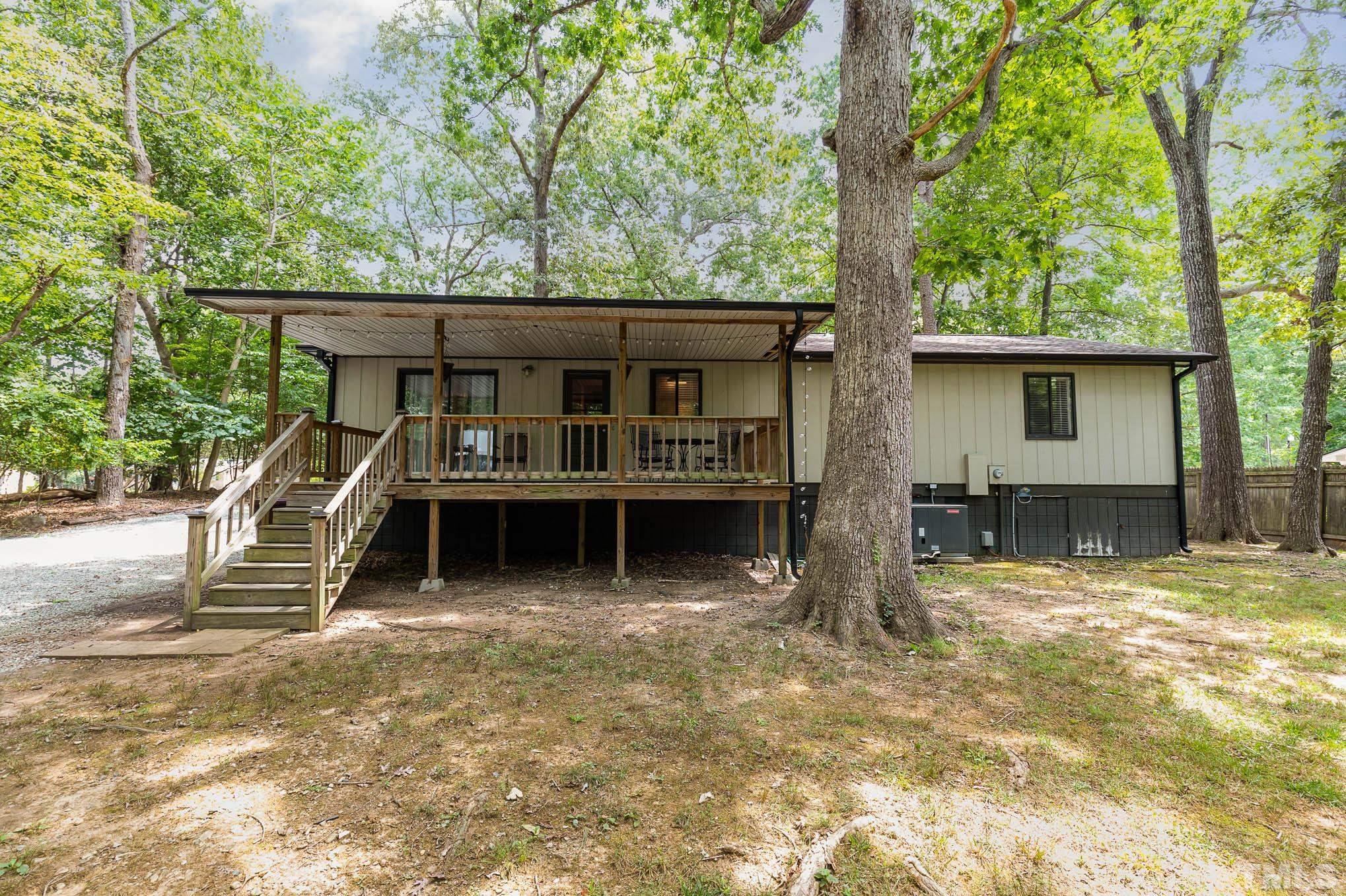 5609 Roslyn Road Durham, NC 27712 - Photo 31 of 31 front view of a house with a large tree