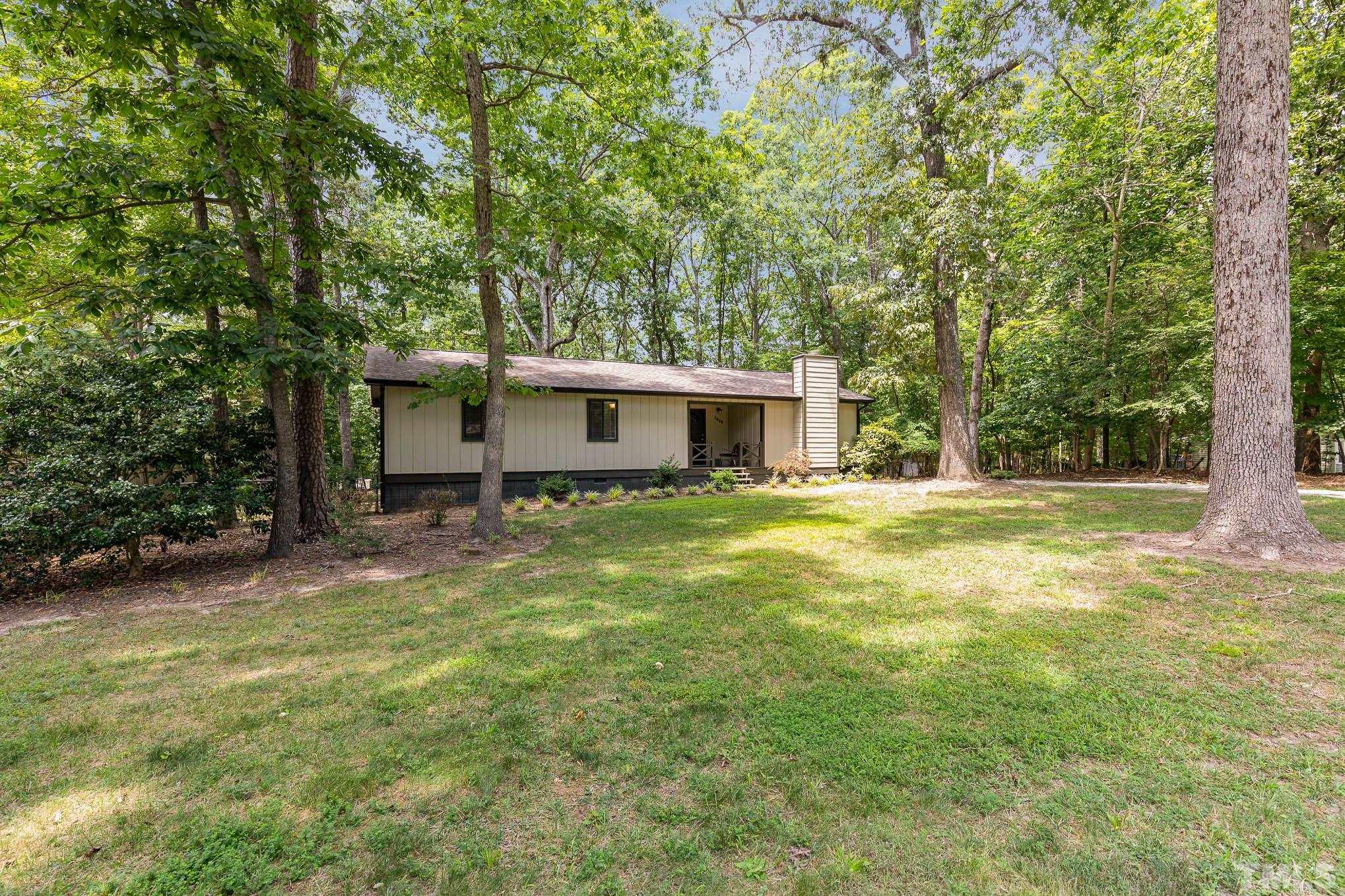 5609 Roslyn Road Durham, NC 27712 - Photo 5 of 31 a front view of house with yard and trees