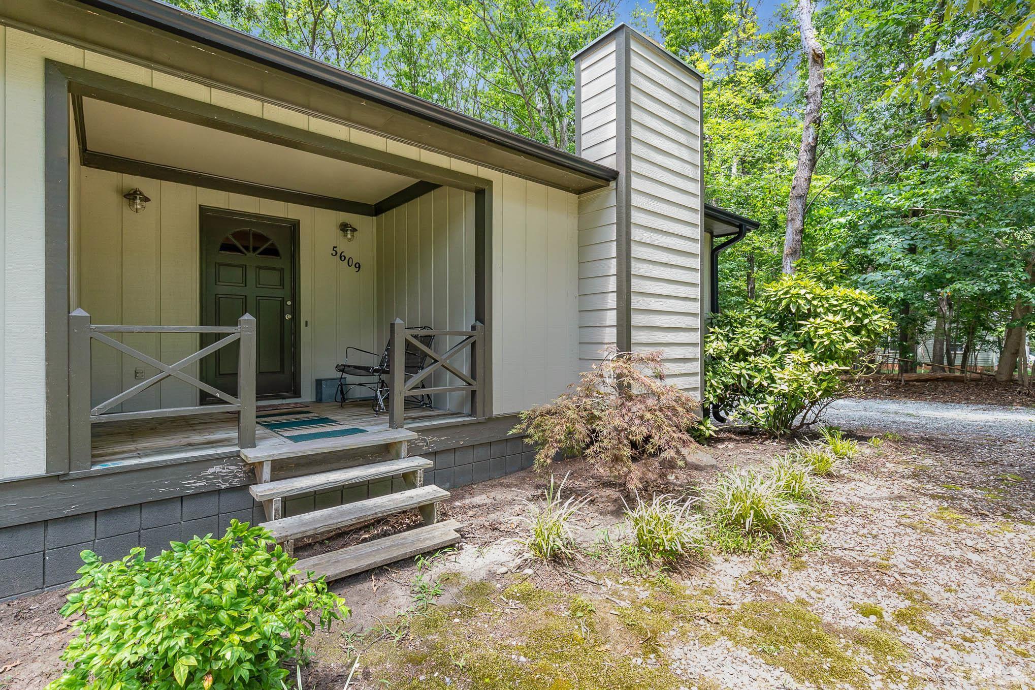5609 Roslyn Road Durham, NC 27712 - Photo 6 of 31 a view of a house with a yard