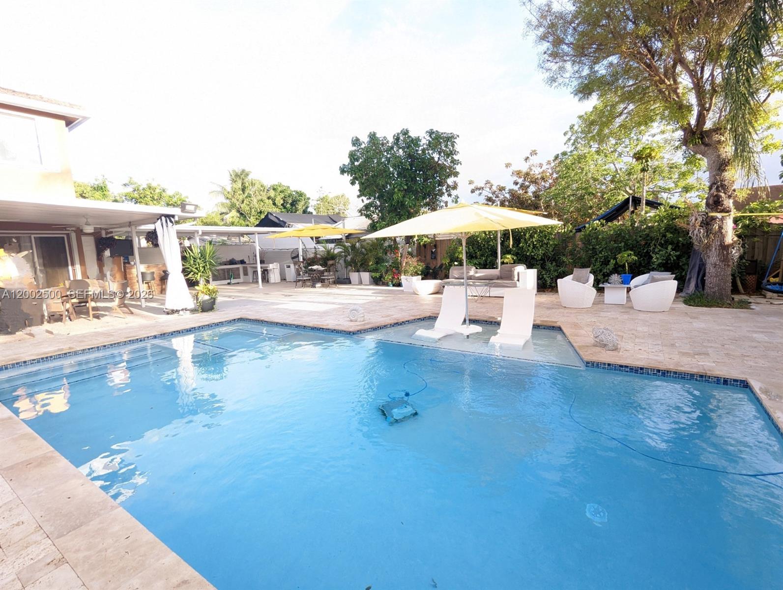a view of a swimming pool with a patio