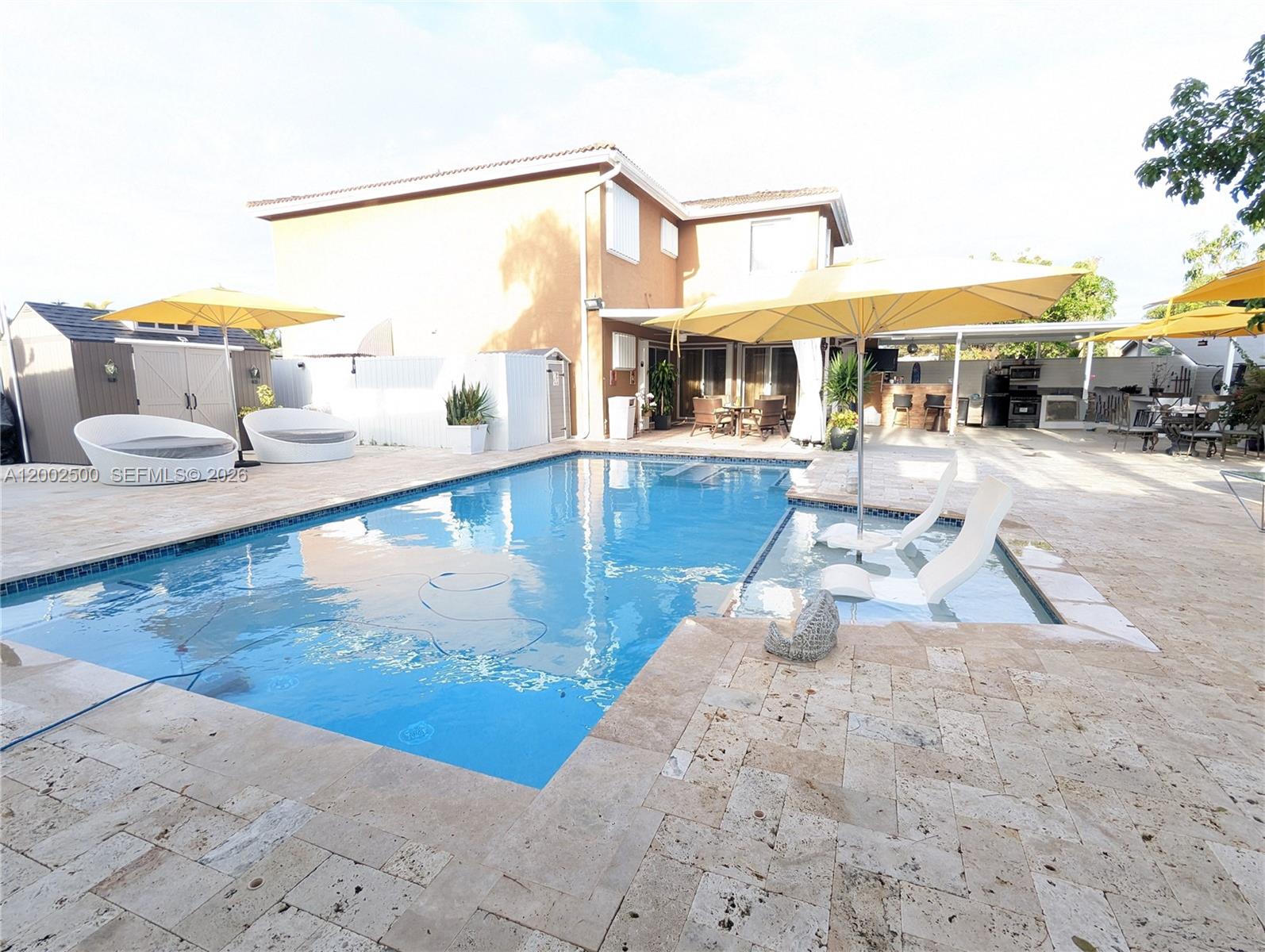 12328 Southwest 251st Terrace Homestead, FL 33032 - Photo 12 of 22 a living room with a table and chairs
