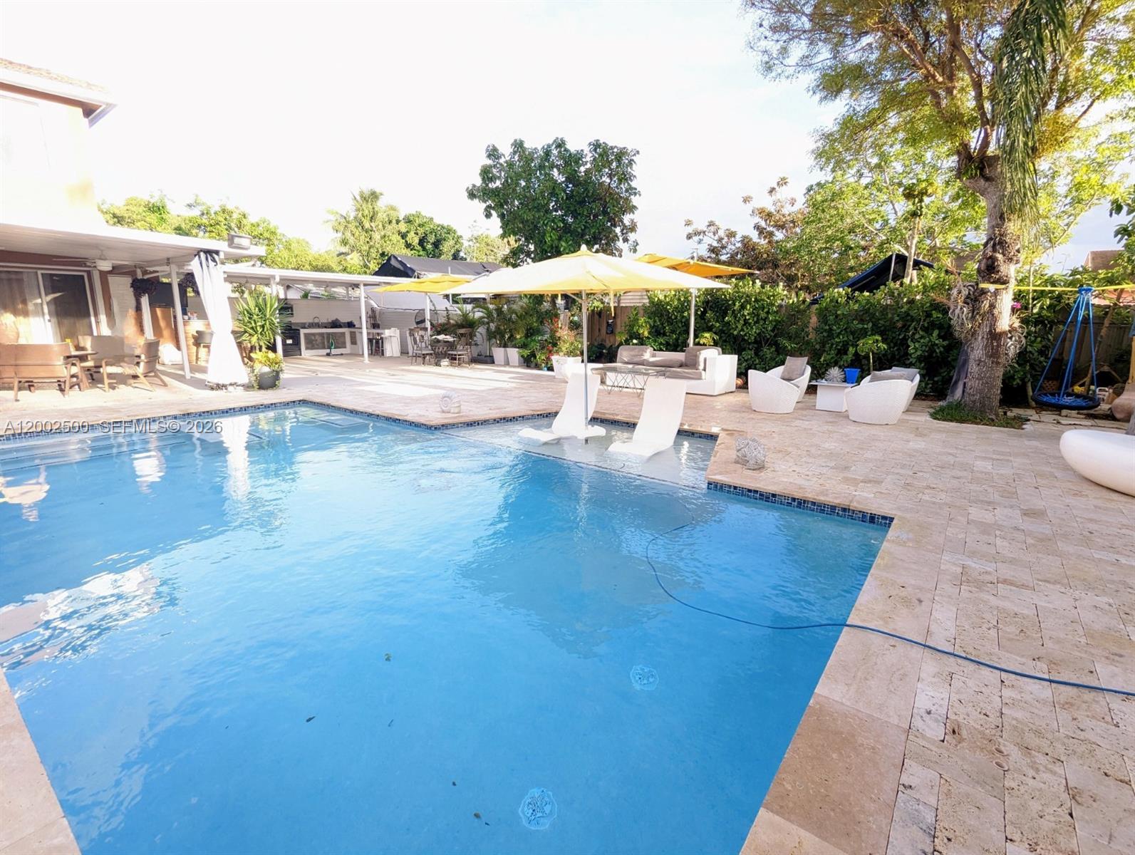 12328 Southwest 251st Terrace Homestead, FL 33032 - Photo 16 of 22 a view of a swimming pool with a patio