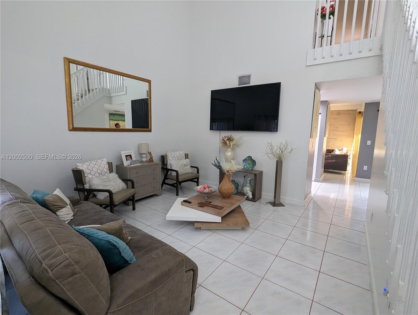 12328 Southwest 251st Terrace Homestead, FL 33032 - Photo 5 of 22 a living room with furniture and a flat screen tv