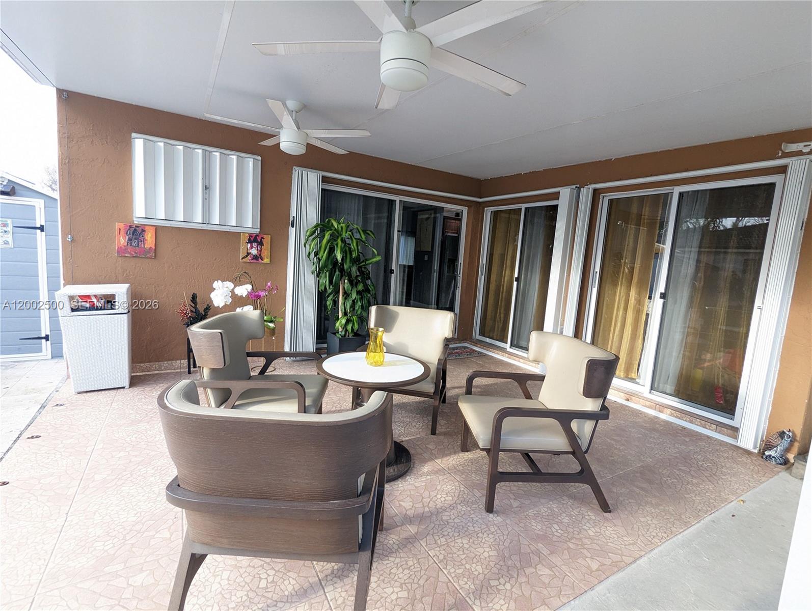 12328 Southwest 251st Terrace Homestead, FL 33032 - Photo 9 of 22 a living room with furniture and a large window