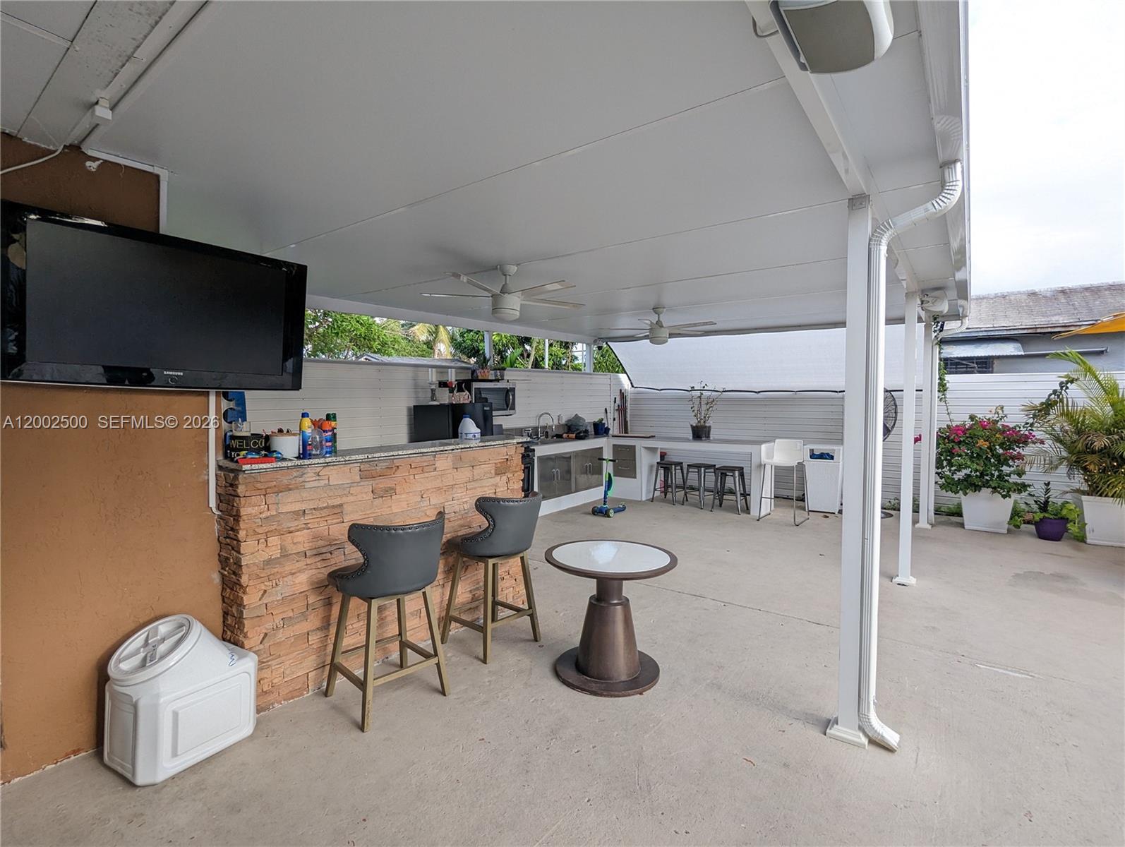 12328 Southwest 251st Terrace Homestead, FL 33032 - Photo 10 of 22 a room with gym equipment and a flat screen tv