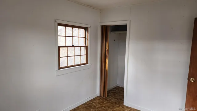 a view of a room that has a window in it