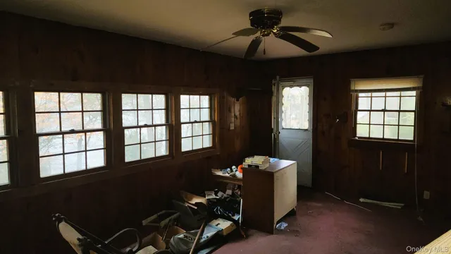 a living room with hardwood floor and furniture