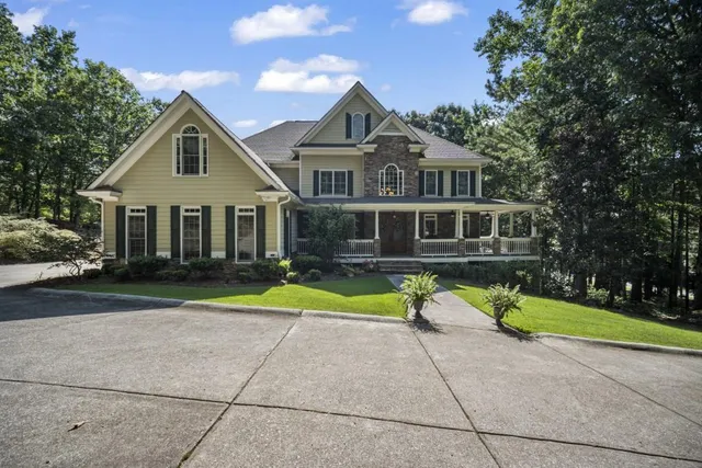 a front view of house with yard and green space