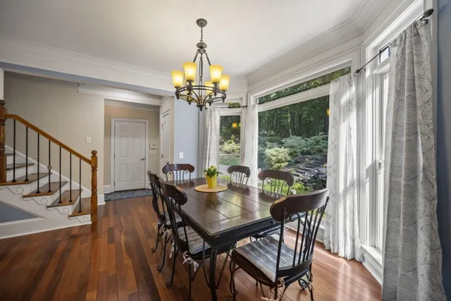 a bathroom with a toilet a sink and a mirror