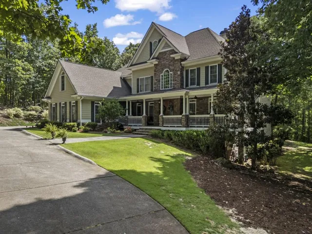 a front view of a house with a yard table and chairs