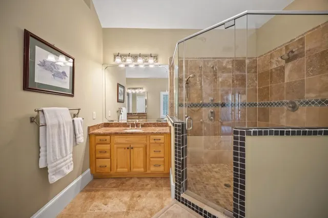 a bed room with a bed and a chandelier