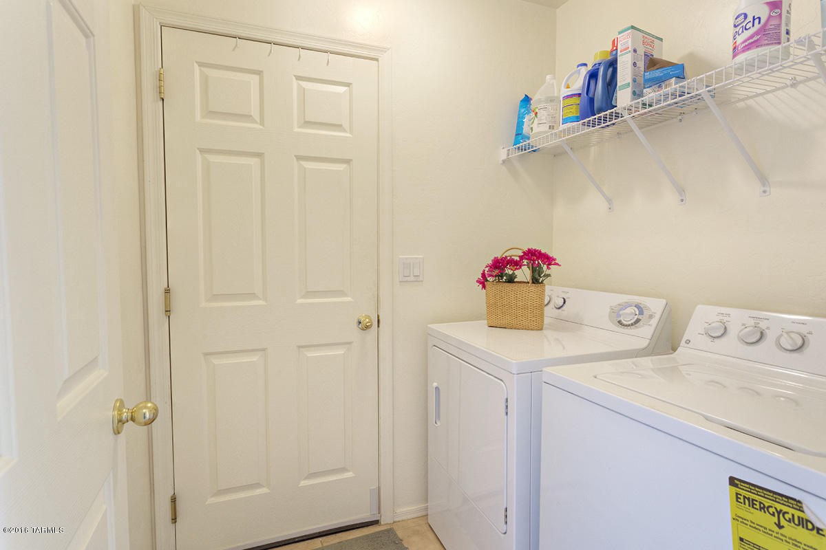 1778 Guess Court Rio Rico, AZ 85648 - Photo 7 of 19 a utility room with a sink and wooden floor