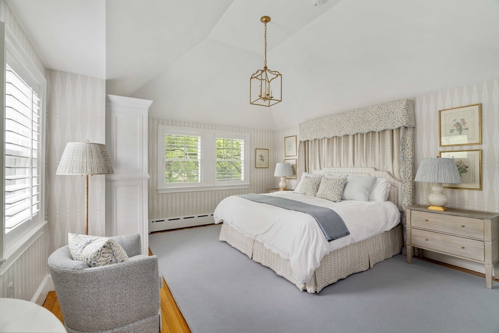 106 Florence Avenue Arlington, MA 02476 - Photo 12 of 34 a spacious bedroom with a bed and a couch