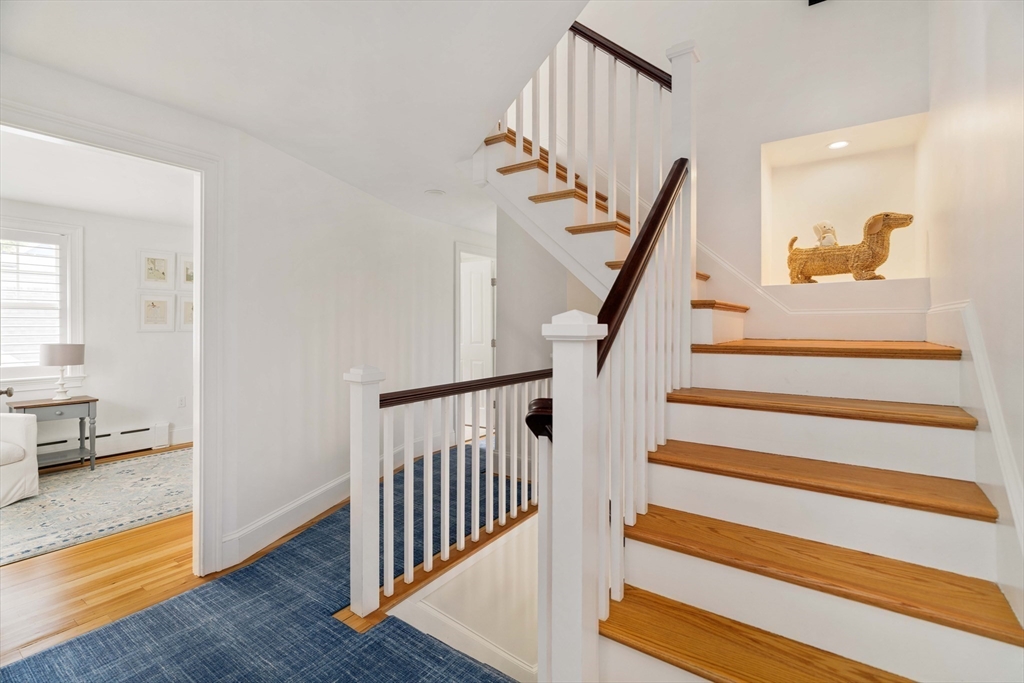 106 Florence Avenue Arlington, MA 02476 - Photo 18 of 34 a view of a hallway with staircase