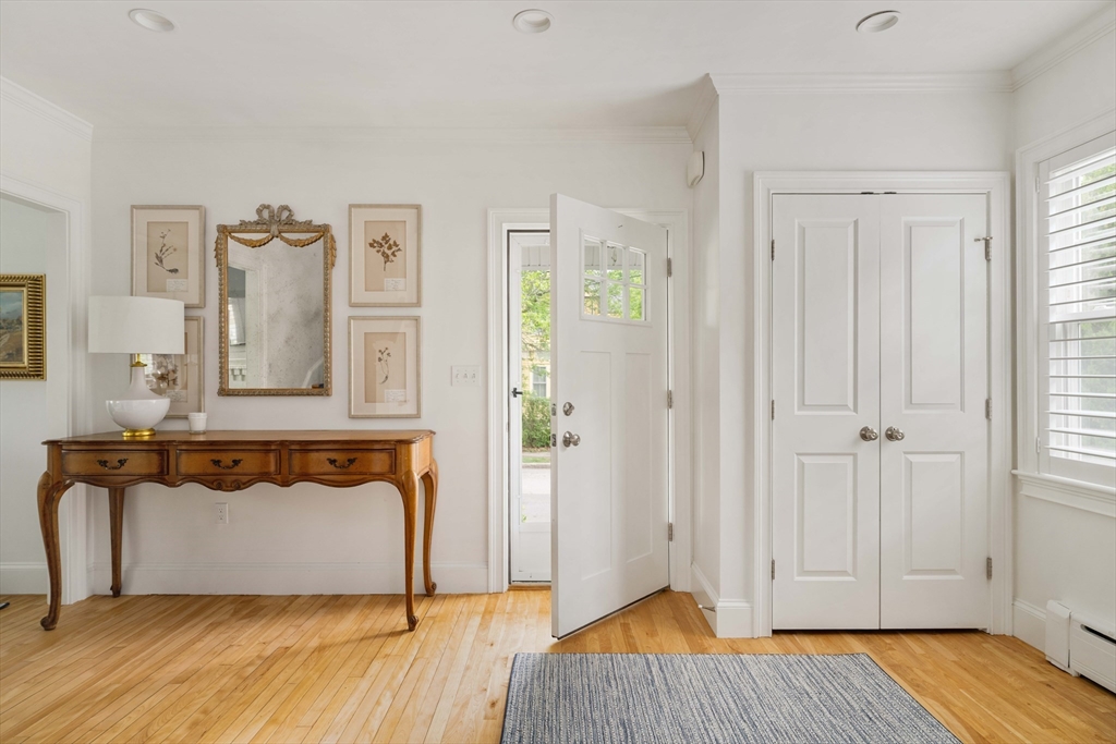 106 Florence Avenue Arlington, MA 02476 - Photo 2 of 34 a view of a bedroom with wooden floor and cabinet