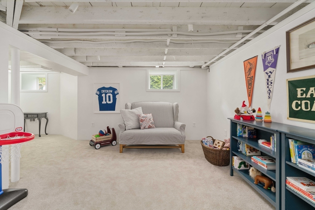 106 Florence Avenue Arlington, MA 02476 - Photo 24 of 34 a livingroom with toys and a couch