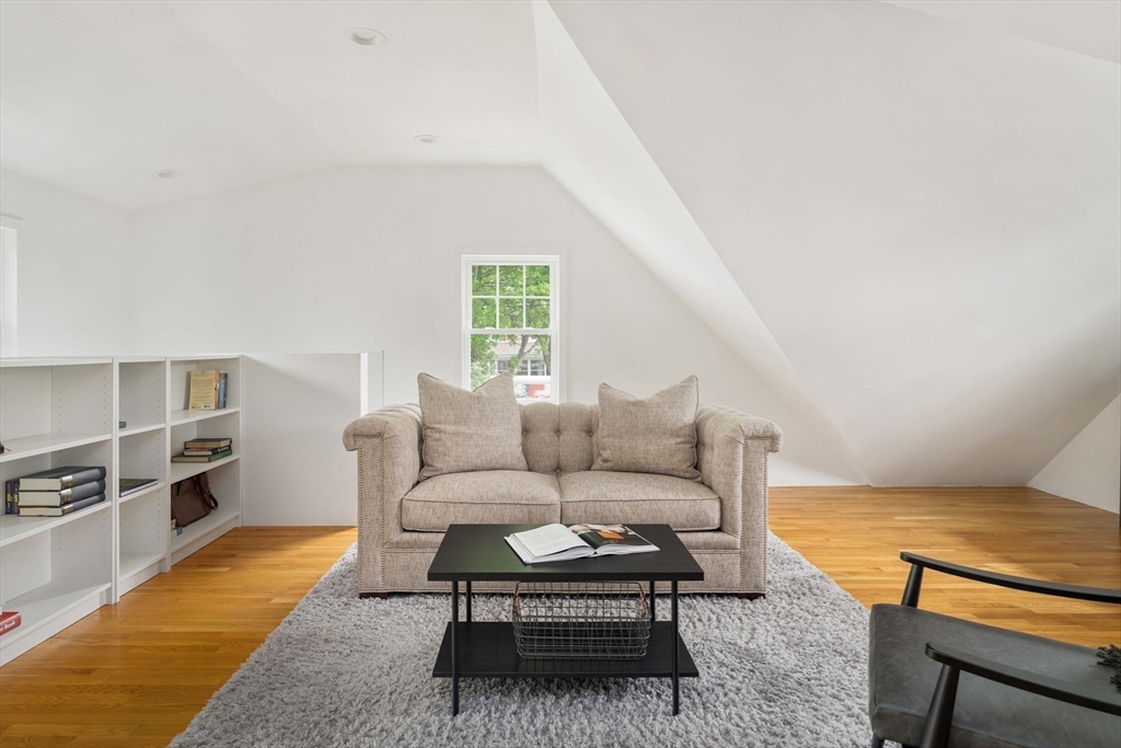 106 Florence Avenue Arlington, MA 02476 - Photo 29 of 34 a living room with furniture a rug and a window