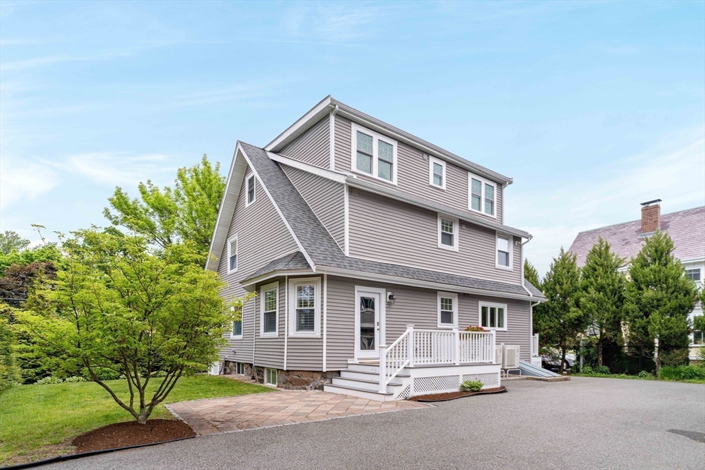 106 Florence Avenue Arlington, MA 02476 - Photo 32 of 34 a front view of a house with a yard