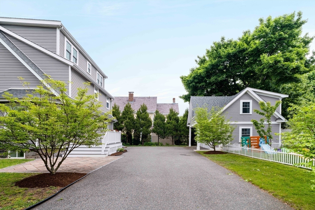 106 Florence Avenue Arlington, MA 02476 - Photo 33 of 34 a front view of a house with a yard and tree s